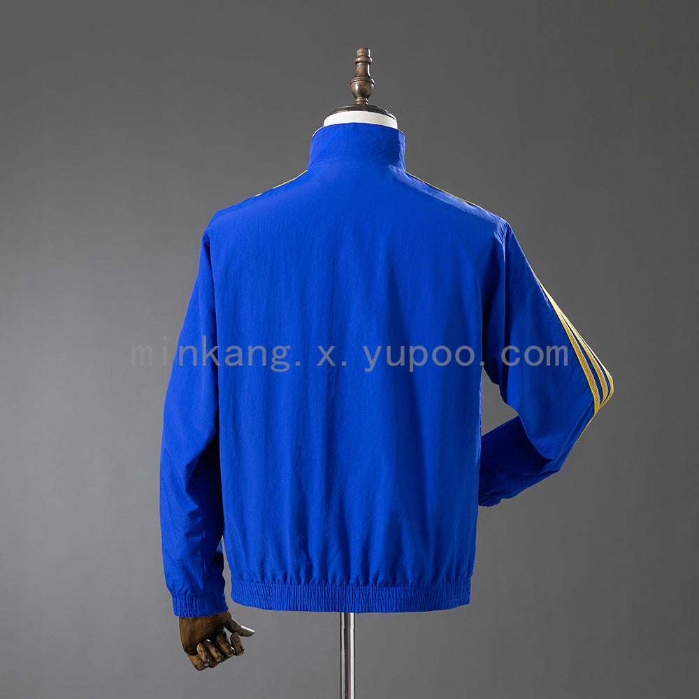 Real Madrid Cortavientos Reversible Azul y Amarillo